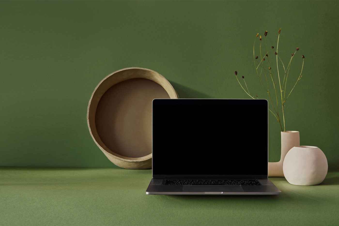 Front View MacBook Pro Mockup with Potted Background FREE PSD