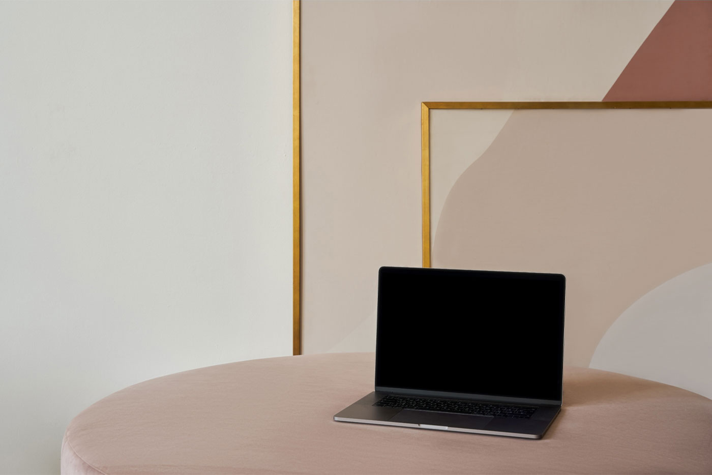 Perspective View of MacBook Pro Mockup on Sofa FREE PSD