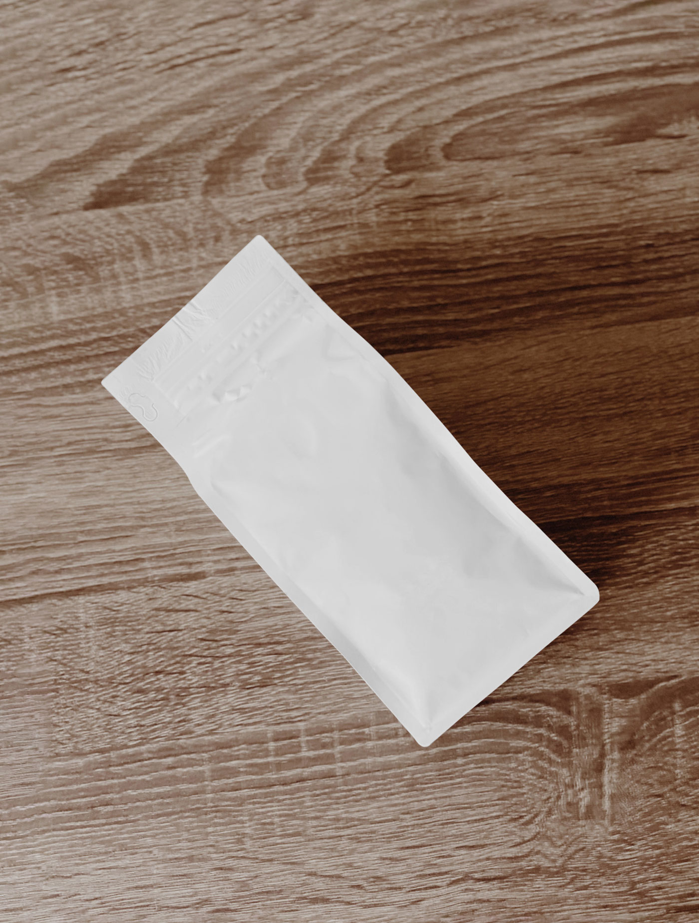 Top View of Coffee Bag Mockup on Wooden Table FREE PSD