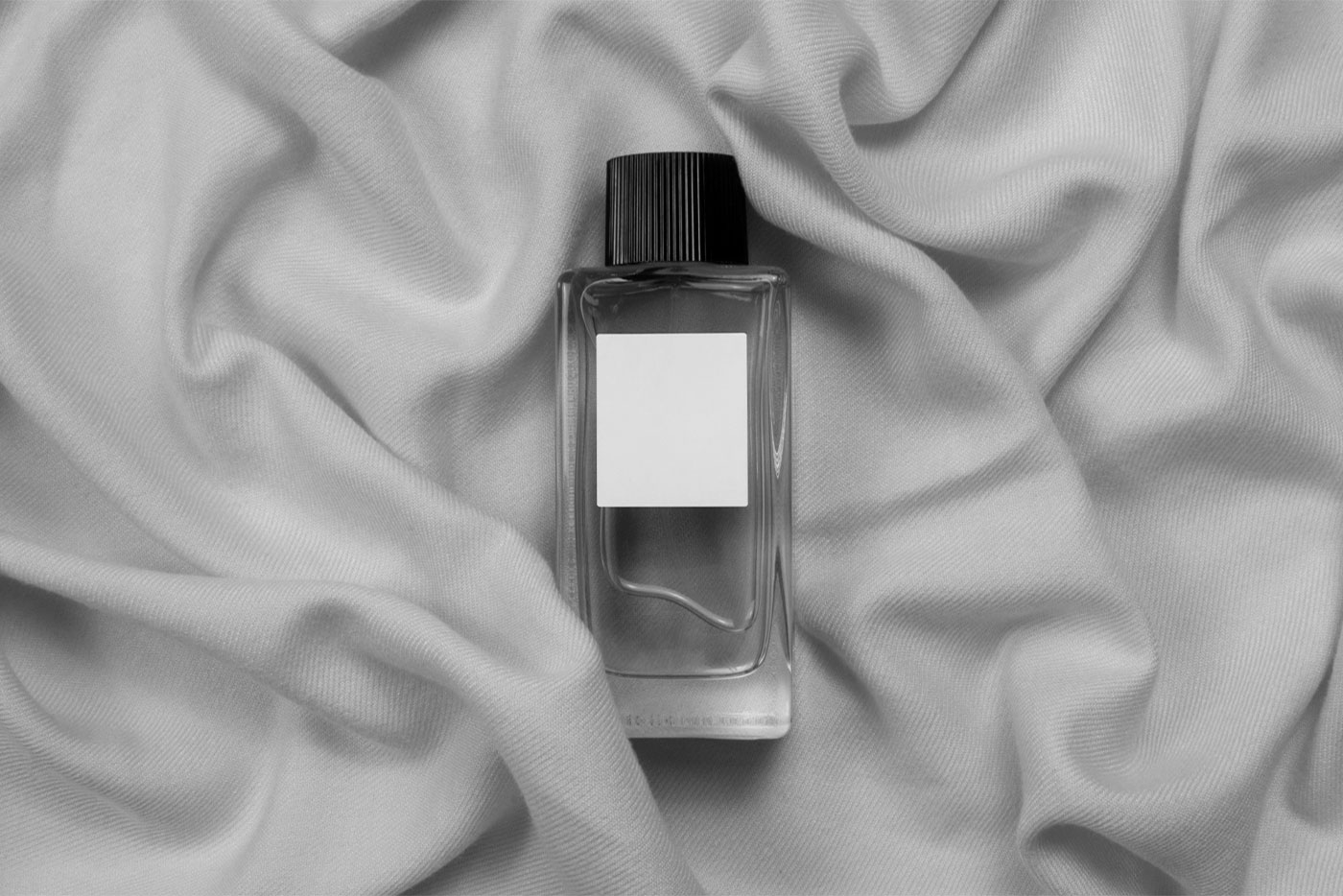 Top View of Glass Bottle Perfume Mockup on Fabric FREE PSD