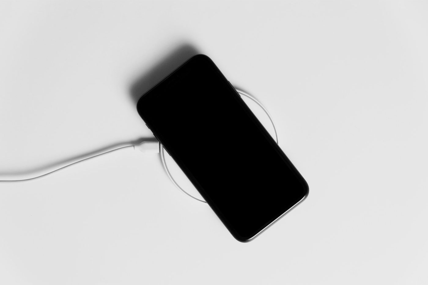 Top View of iPhone Mockup on Charger FREE PSD