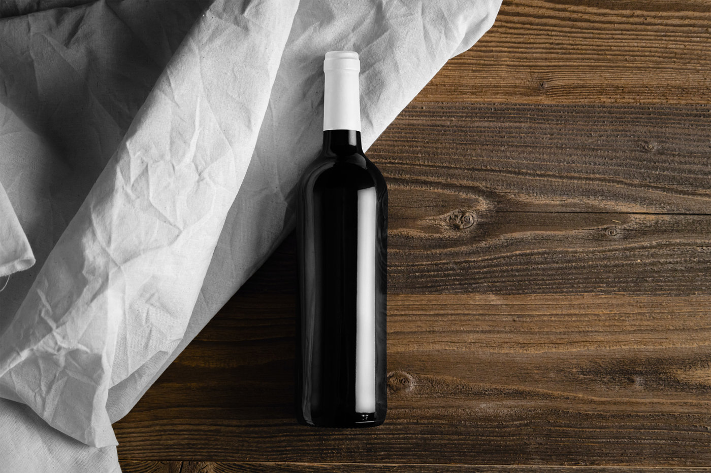 Top View of Wine Bottle Mockup on Wooden Desk FREE PSD