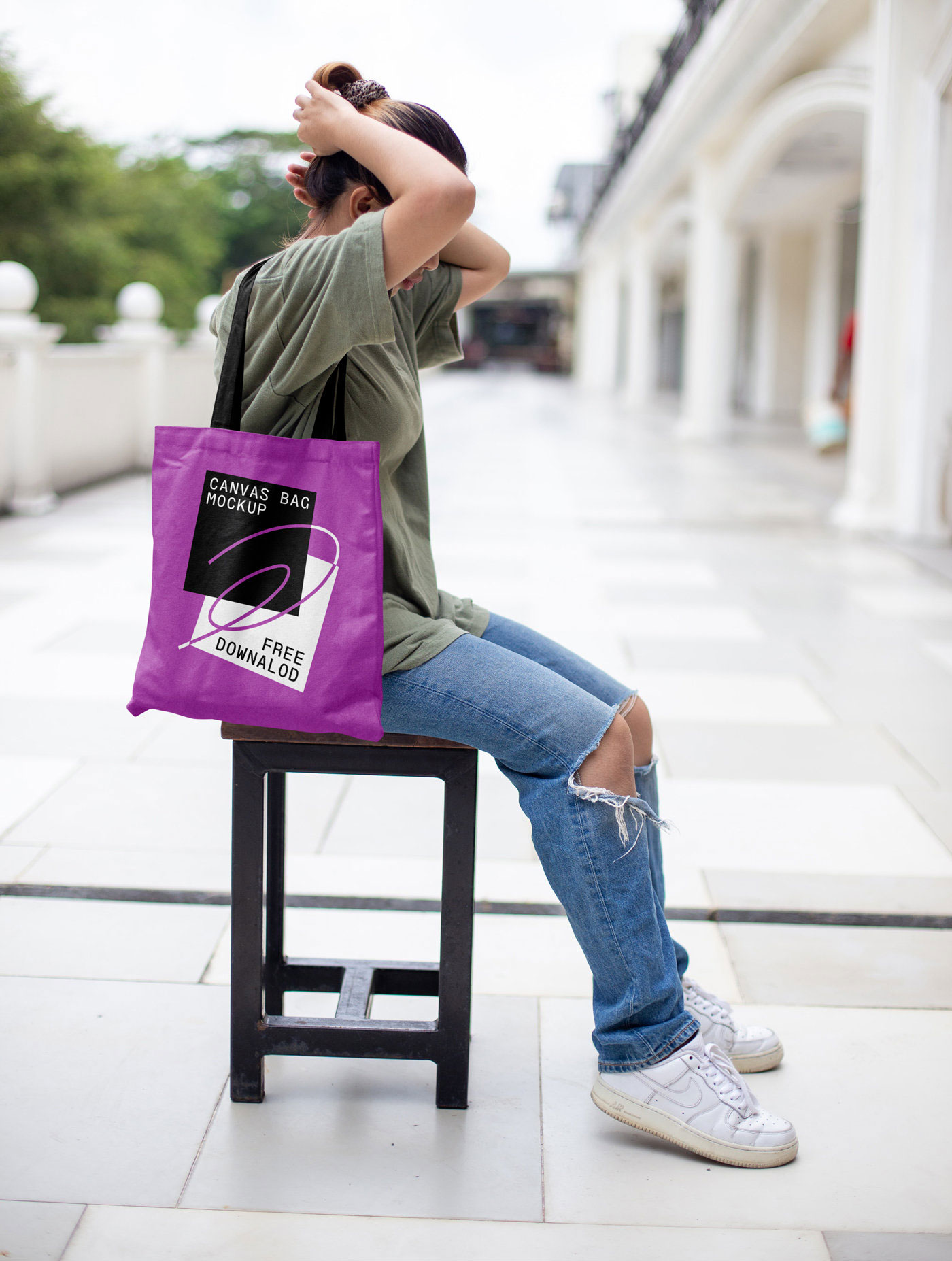 Front View of Realistic Canvas Bag Mockup with Women FREE PSD