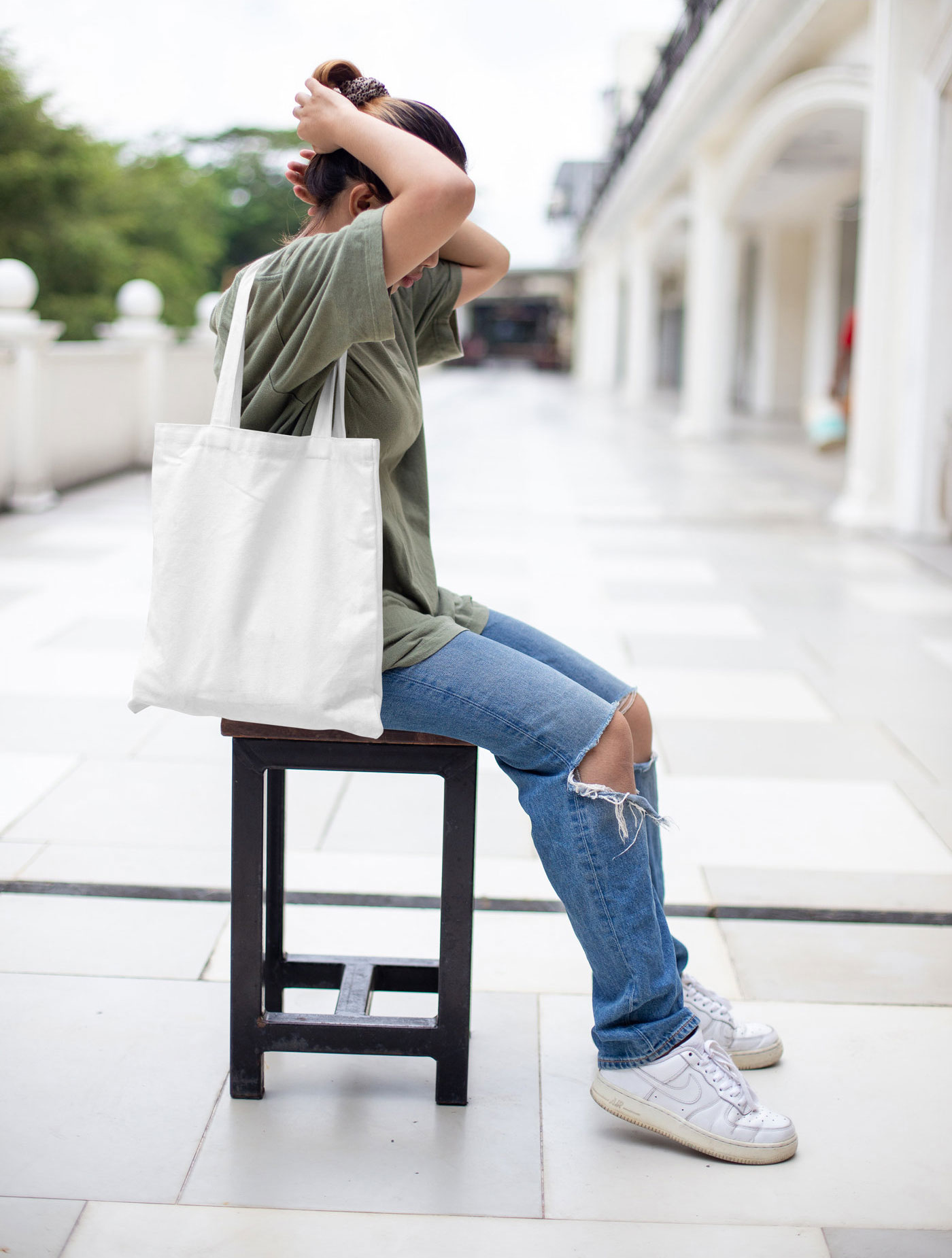Front View of Realistic Canvas Bag Mockup with Women FREE PSD