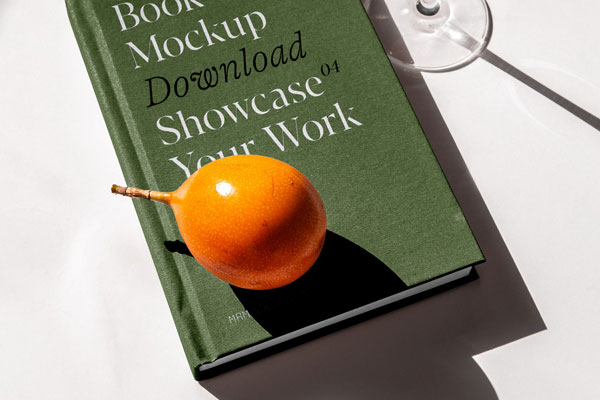 Perspective Sight of Book Cover Mockup with Glass of Juice FREE PSD