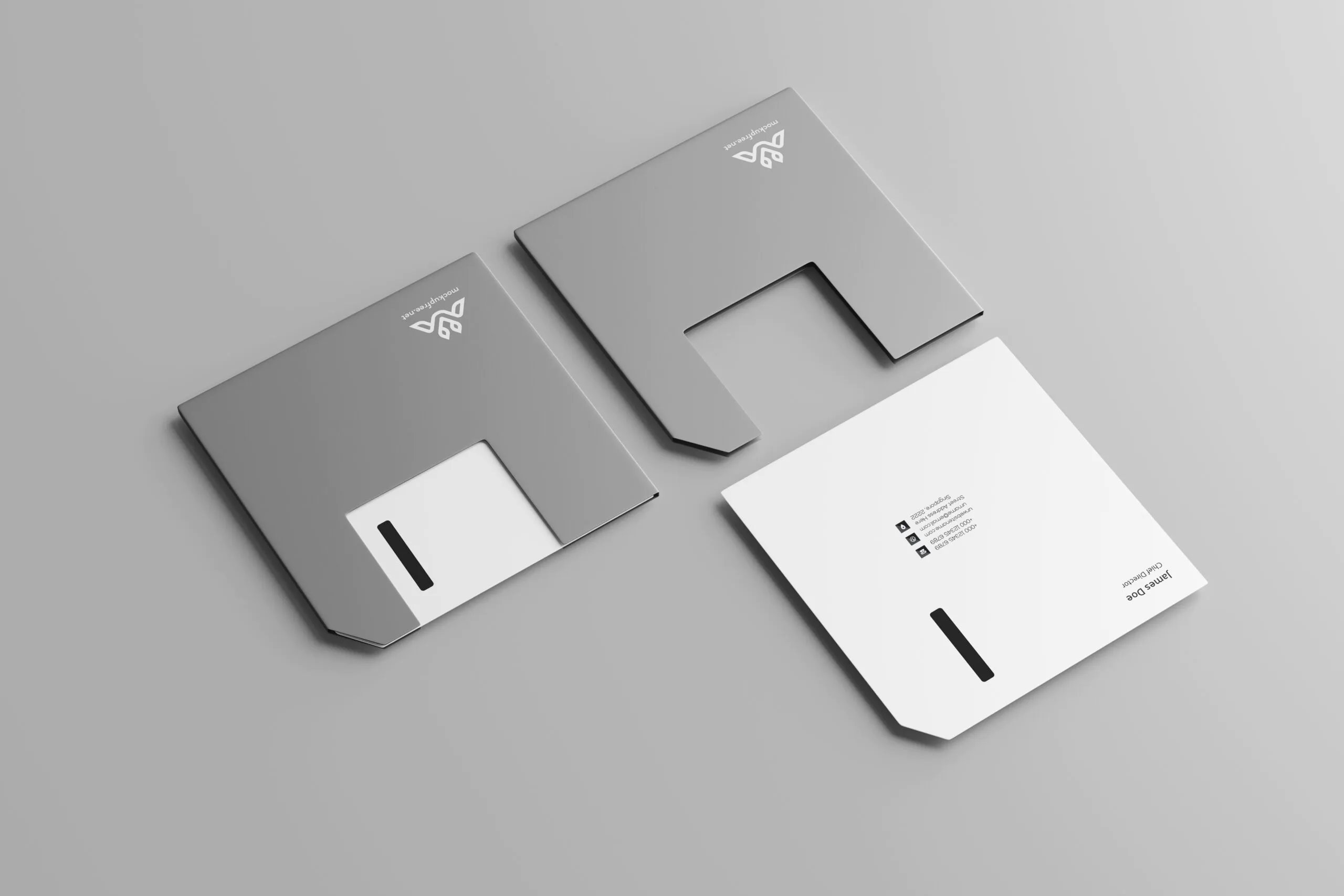 5 Mockups of Floppy Disk Shaped Business Cards in Various Views FREE PSD