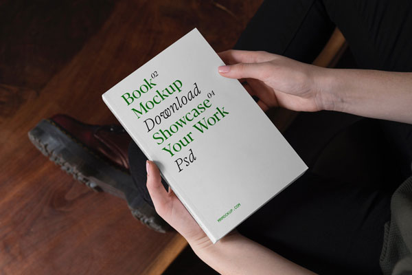 Top View of Hand-holding Book Mockup FREE PSD