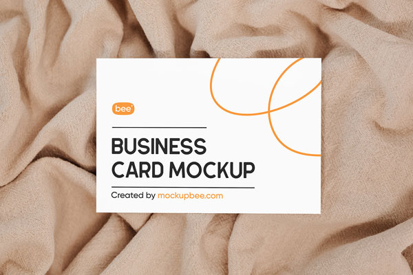 Top Shot of Business Card Mockup on Blanket FREE PSD