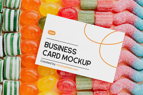 Top View of Business Card Mockup on Candies FREE PSD