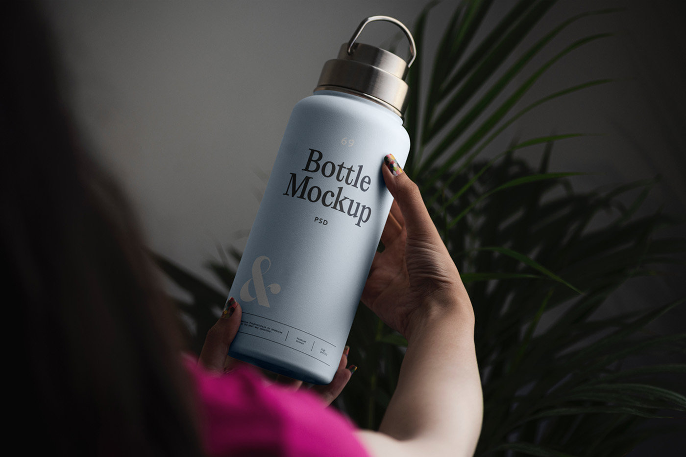 Perspective Vision of Woman Holding Bottle Mockup FREE PSD