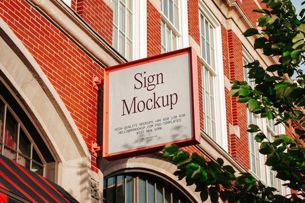 Sign Mockup on Brick Building in Perspective View FREE PSD