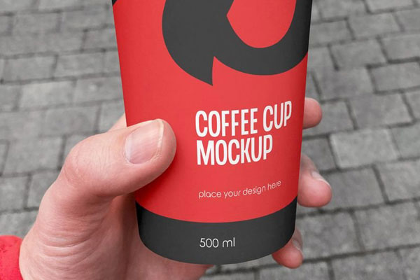 Facing Vision of Coffee Cup Mockup in Hand FREE PSD