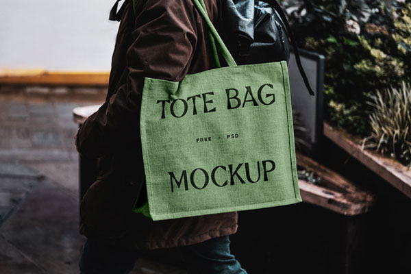 Front View of Eco Bag Mockup Carrying by Man FREE PSD