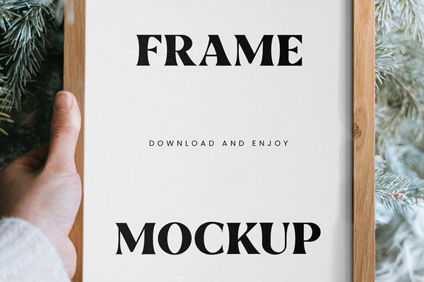 Close-up Vision of Wooden Frame Mockup in Hand FREE PSD