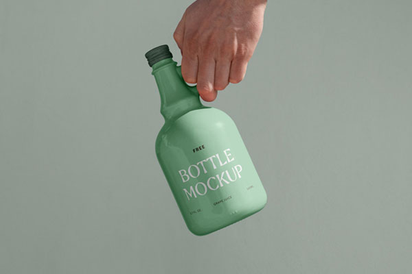 Front View of Ceramic Bottle Mockup in Hand FREE PSD