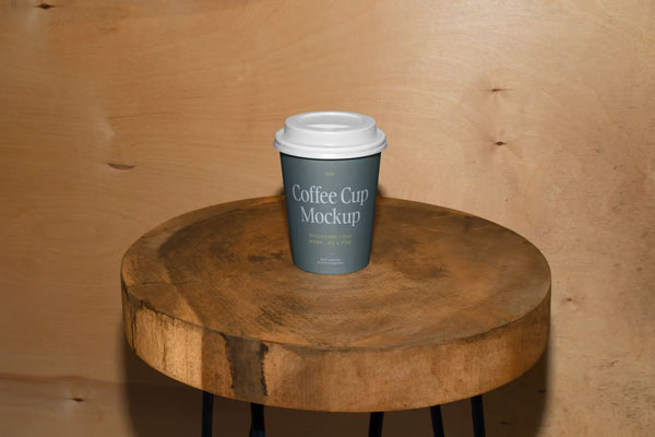 Free Facing View of Coffee Cup Mockup on Wooden Stool PSD Template