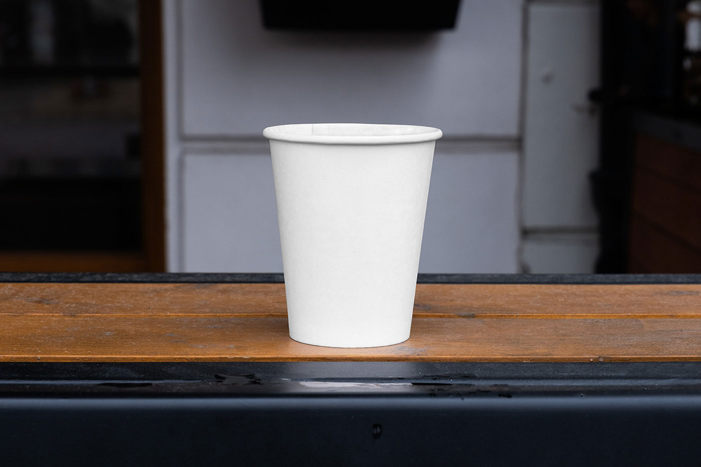 Free Facing Vision of Paper Cup Mockup on Railing PSD Template