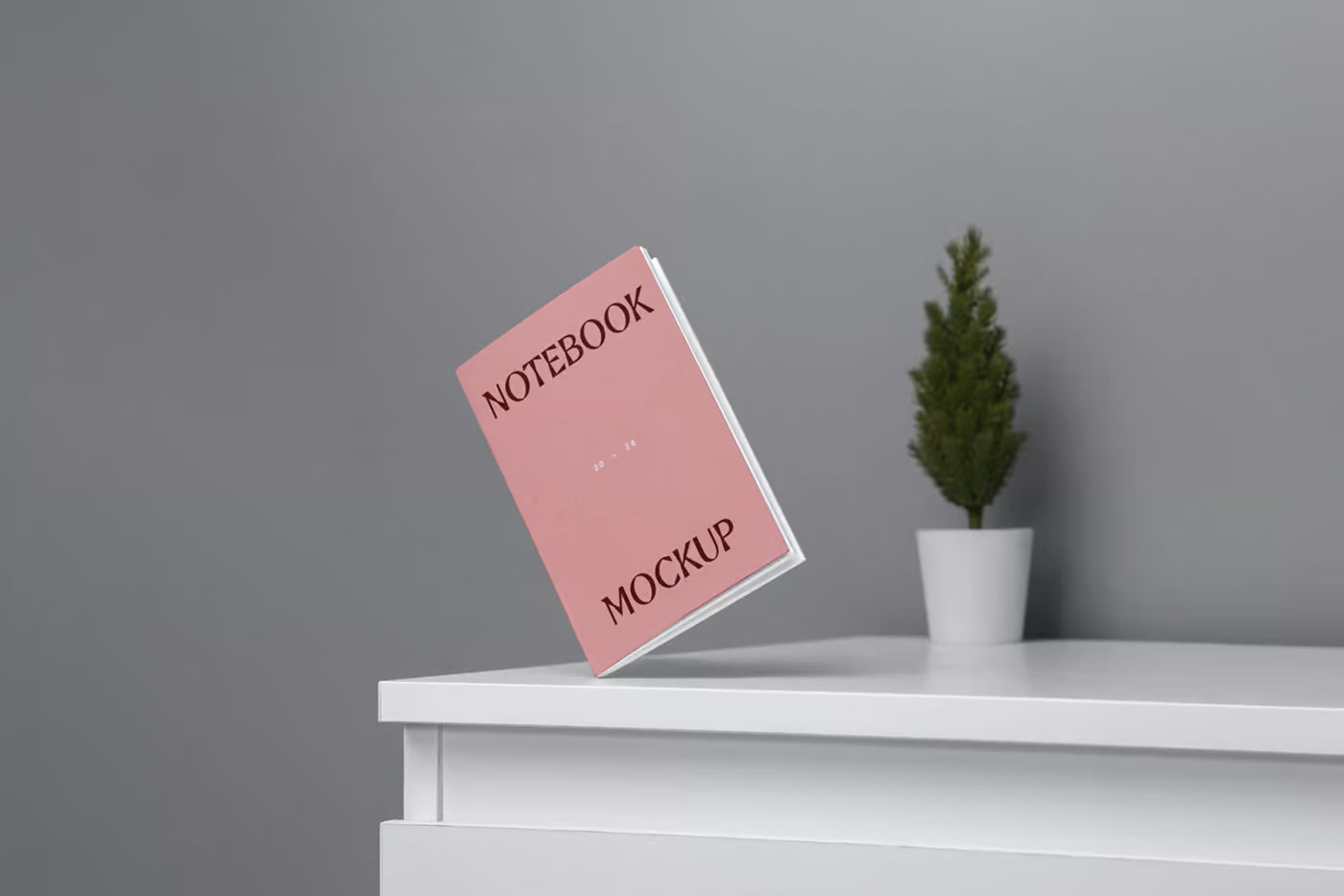 Free Perspective View of Mini A5 Notebook Mockup PSD Template