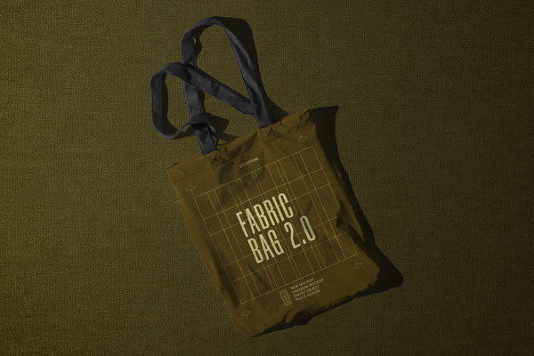 Free Top View of Fabric Bag Mockup on Textured Background PSD Template