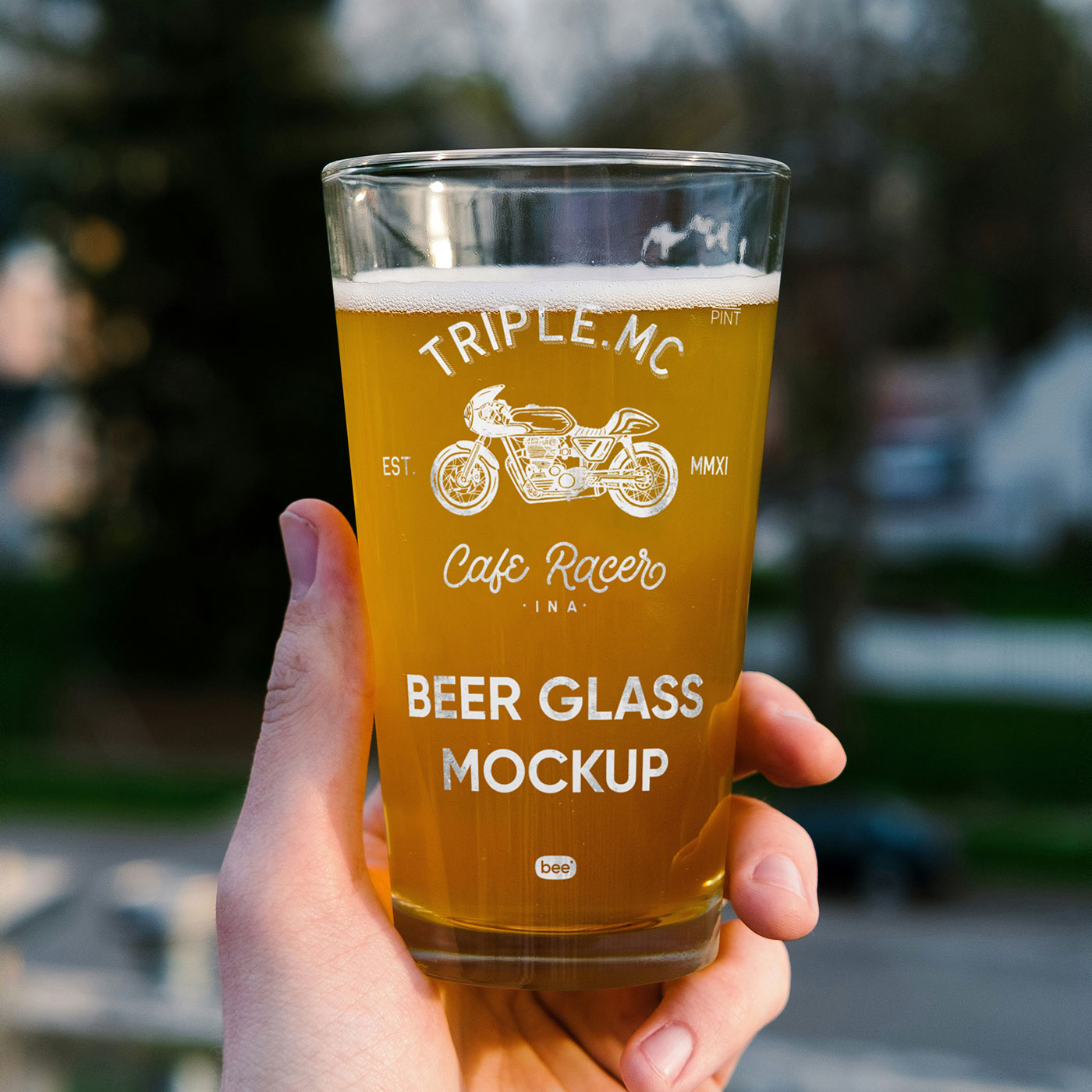 Free Beer Glass in Hand Mockup PSD Template