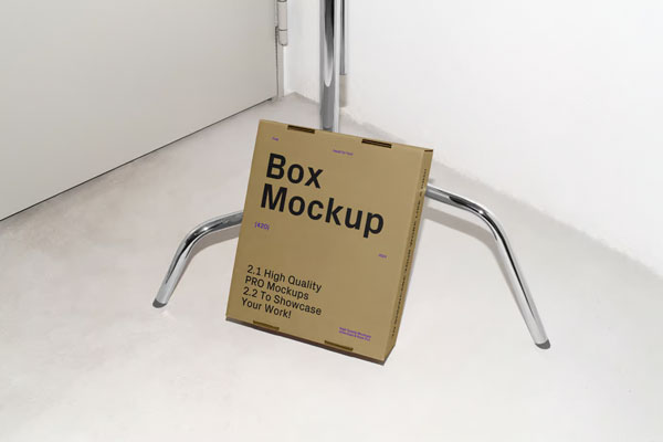Free Cardboard Box Leaning Against Tripod Mockup PSD Template