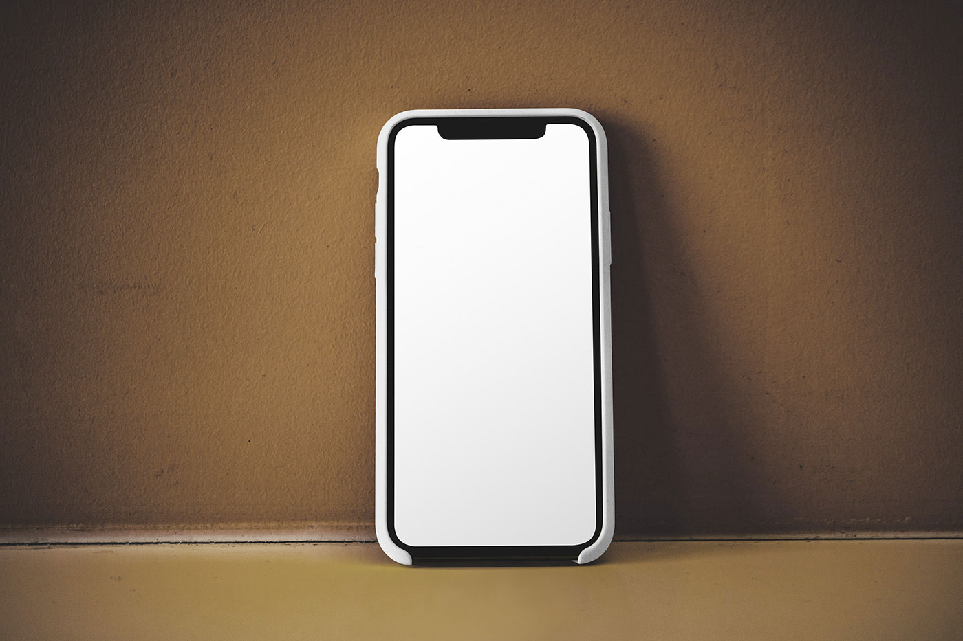 Free iPhone on Concrete Wall Mockup PSD Template