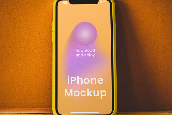 Free iPhone on Concrete Wall Mockup PSD Template