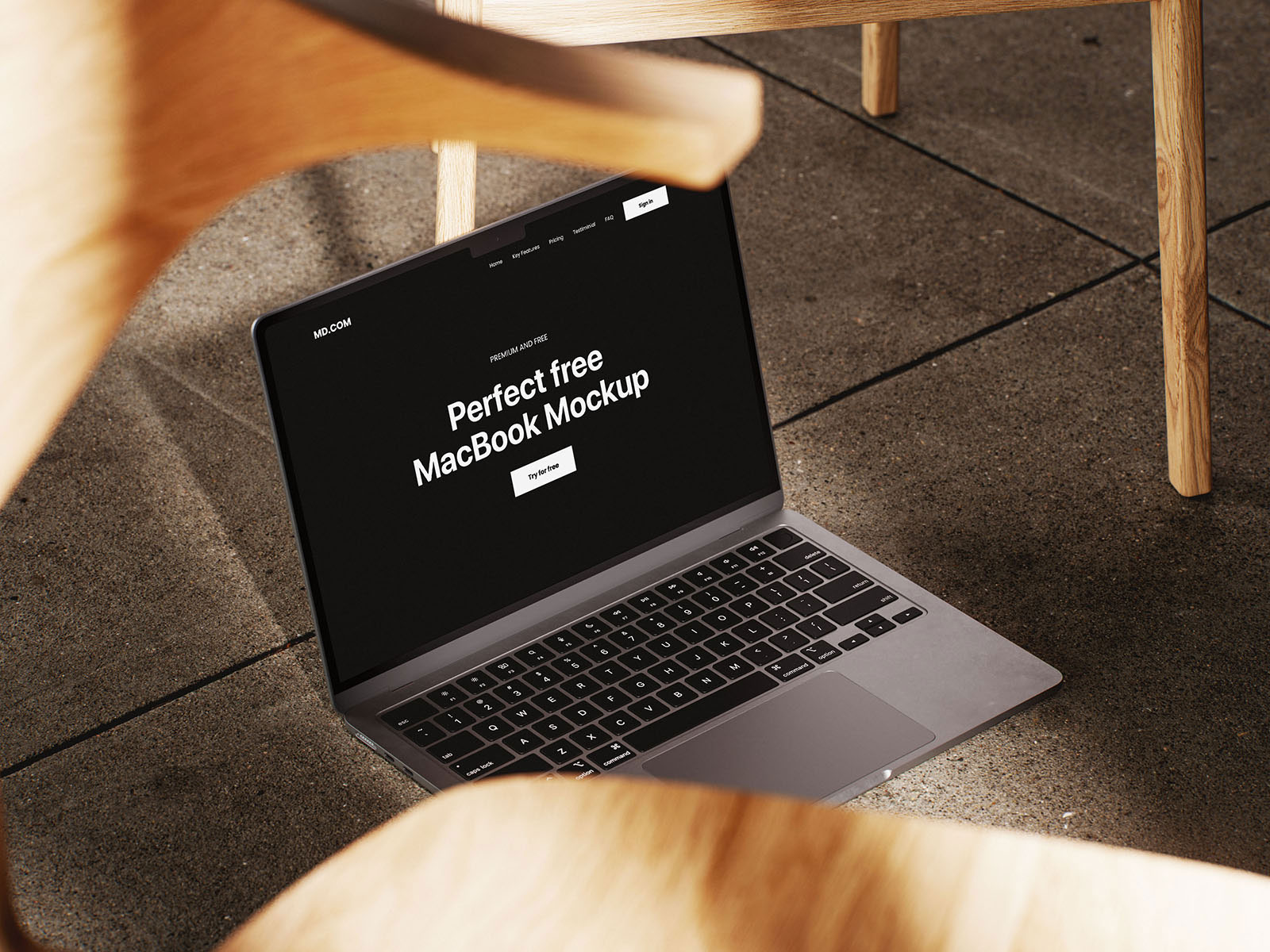 Free MacBook Mockup on Wooden Chair PSD Template