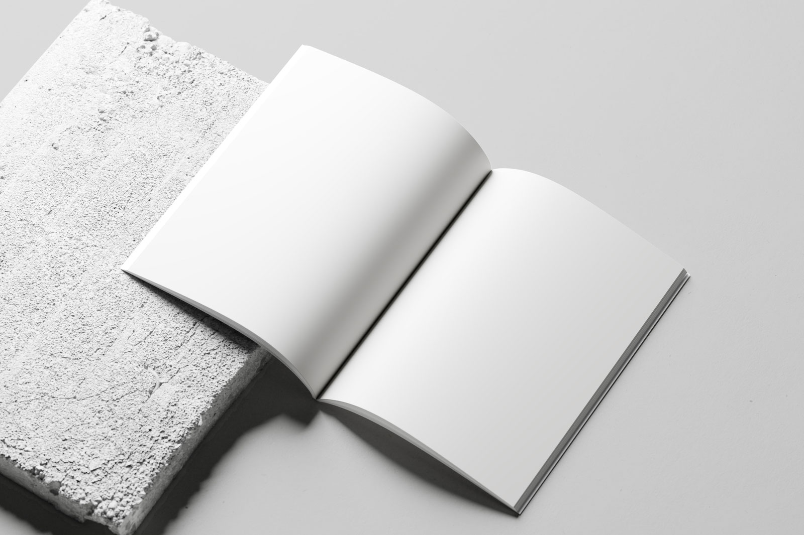 Free Open A4 Magazine Mockup on Concrete PSD Template
