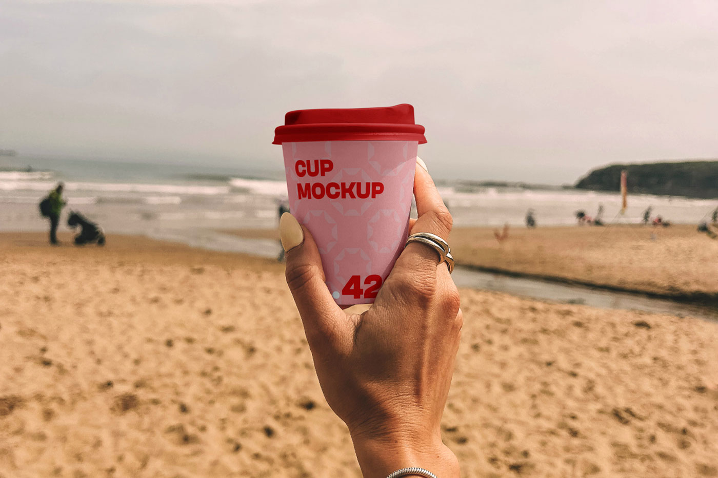 Free Paper Coffee Cup on the Beach Mockup PSD Template