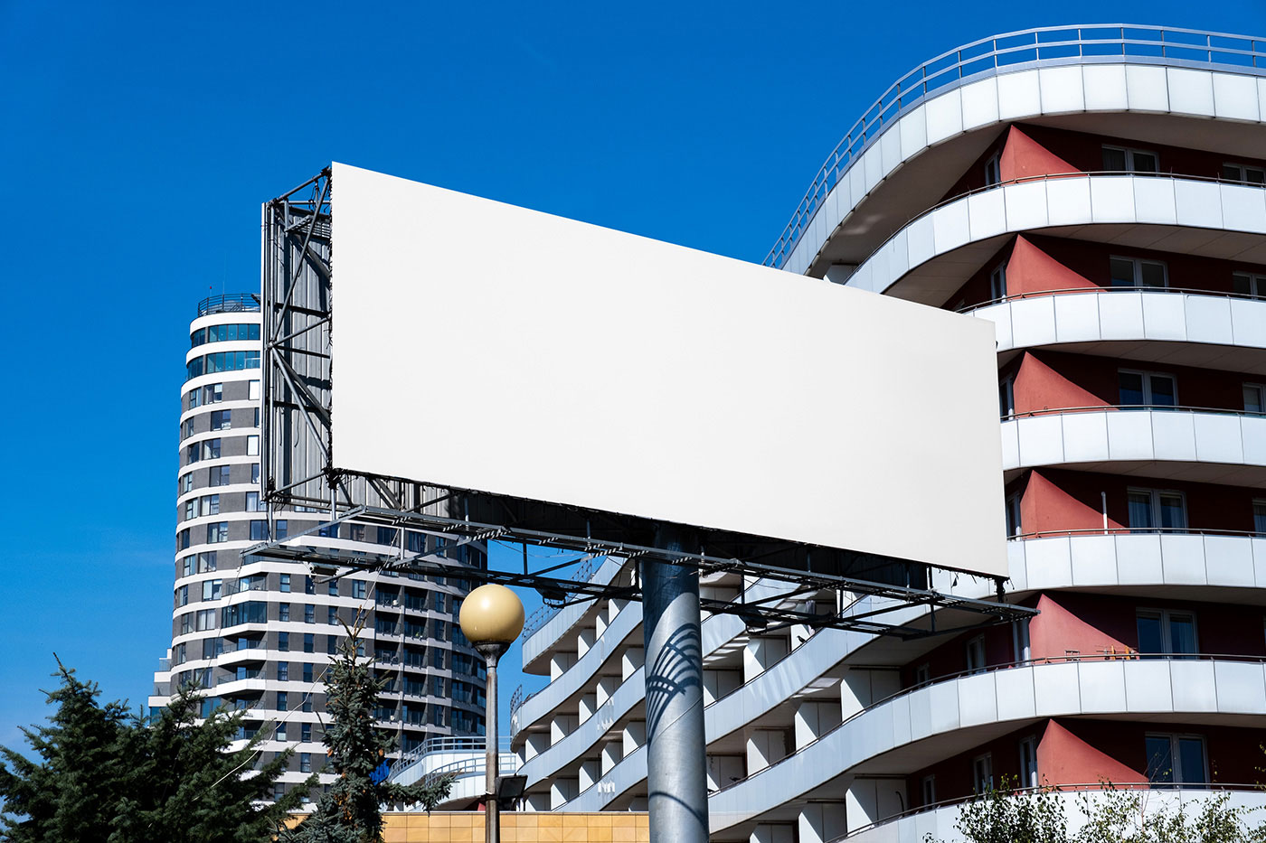 Free Rectangle Billboard in City Mockup PSD Template