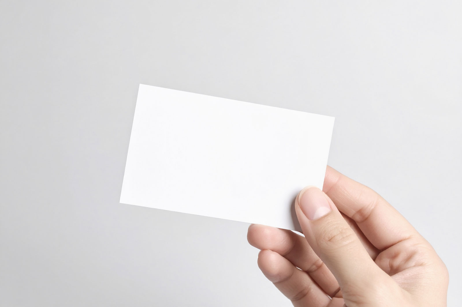 Free Business Card Holding by Hand Mockup PSD Template