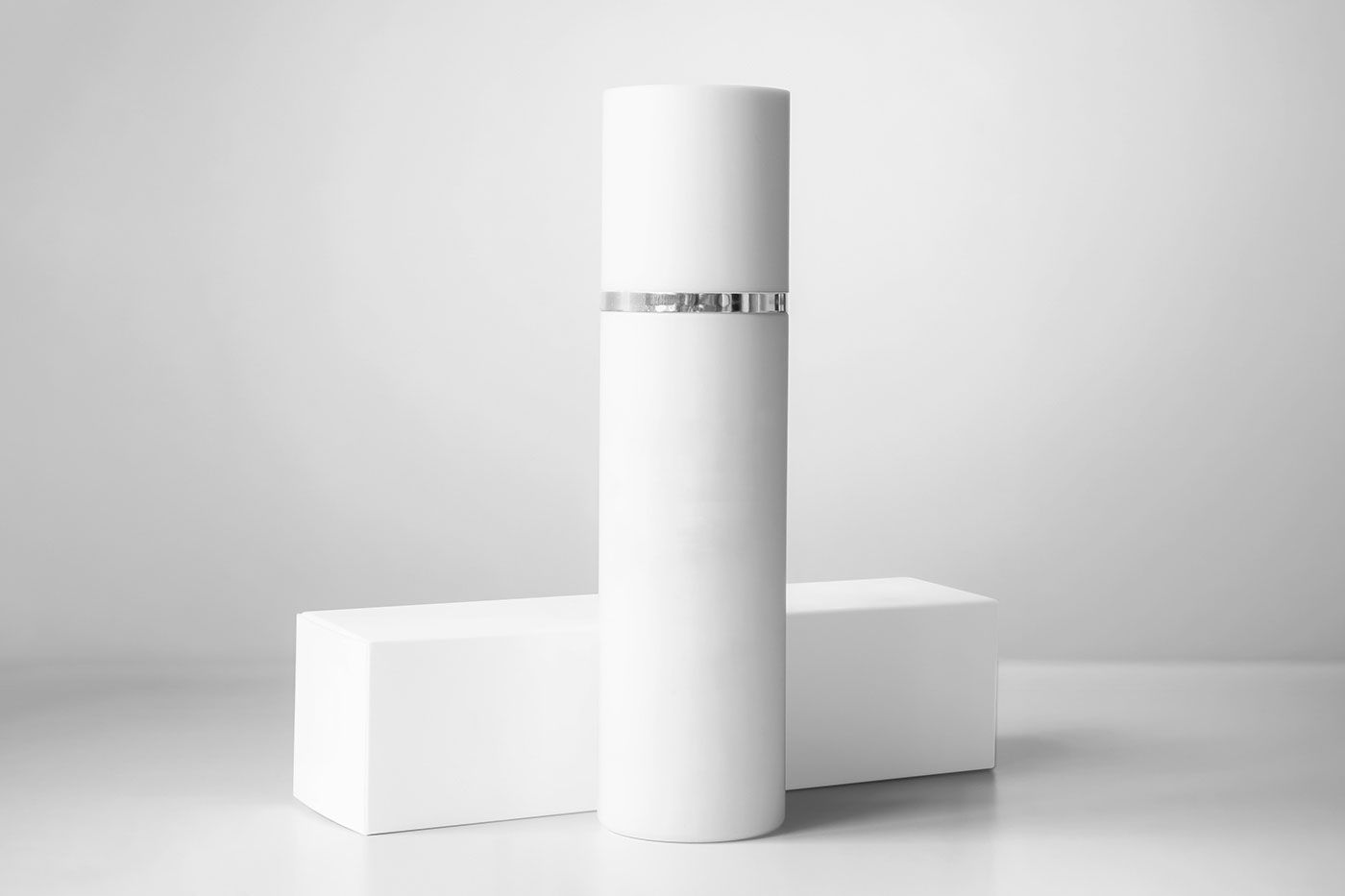 Free Cosmetic Bottle with Box Mockup PSD Template
