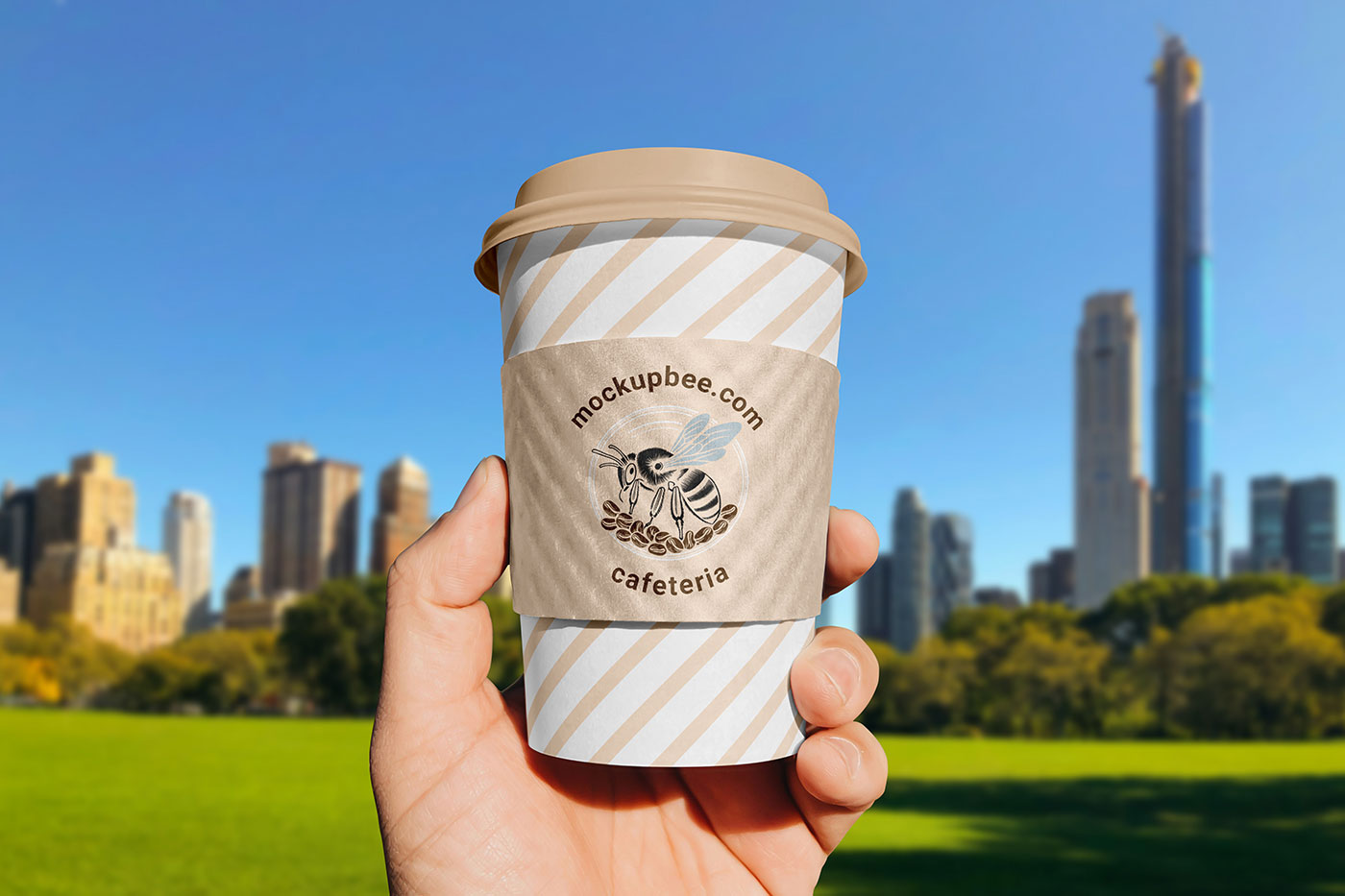 Free Paper Cup Sleeve in Hand Mockup PSD Template