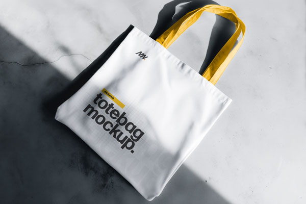 Free Tote Bag Mockup on Concrete Floor PSD Template