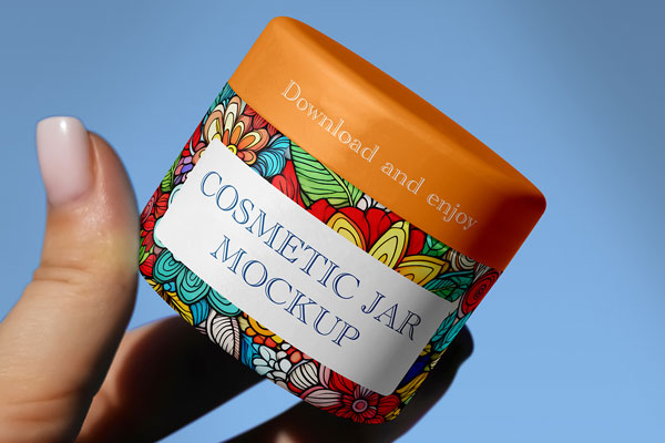 Free Cosmetic Jar in Hand Mockup PSD Template