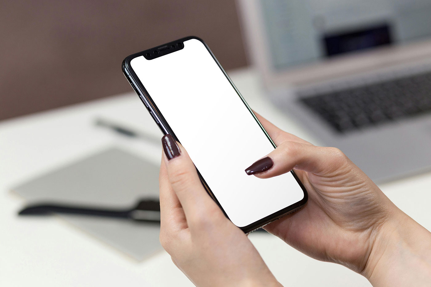 Free iPhone in Woman Hands Mockup PSD Template