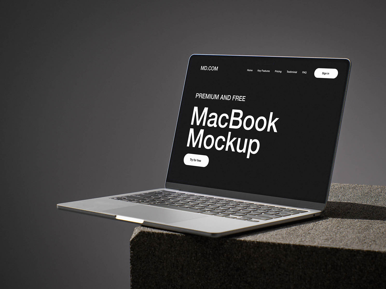Free MacBook on Concrete Cube Mockup PSD Template