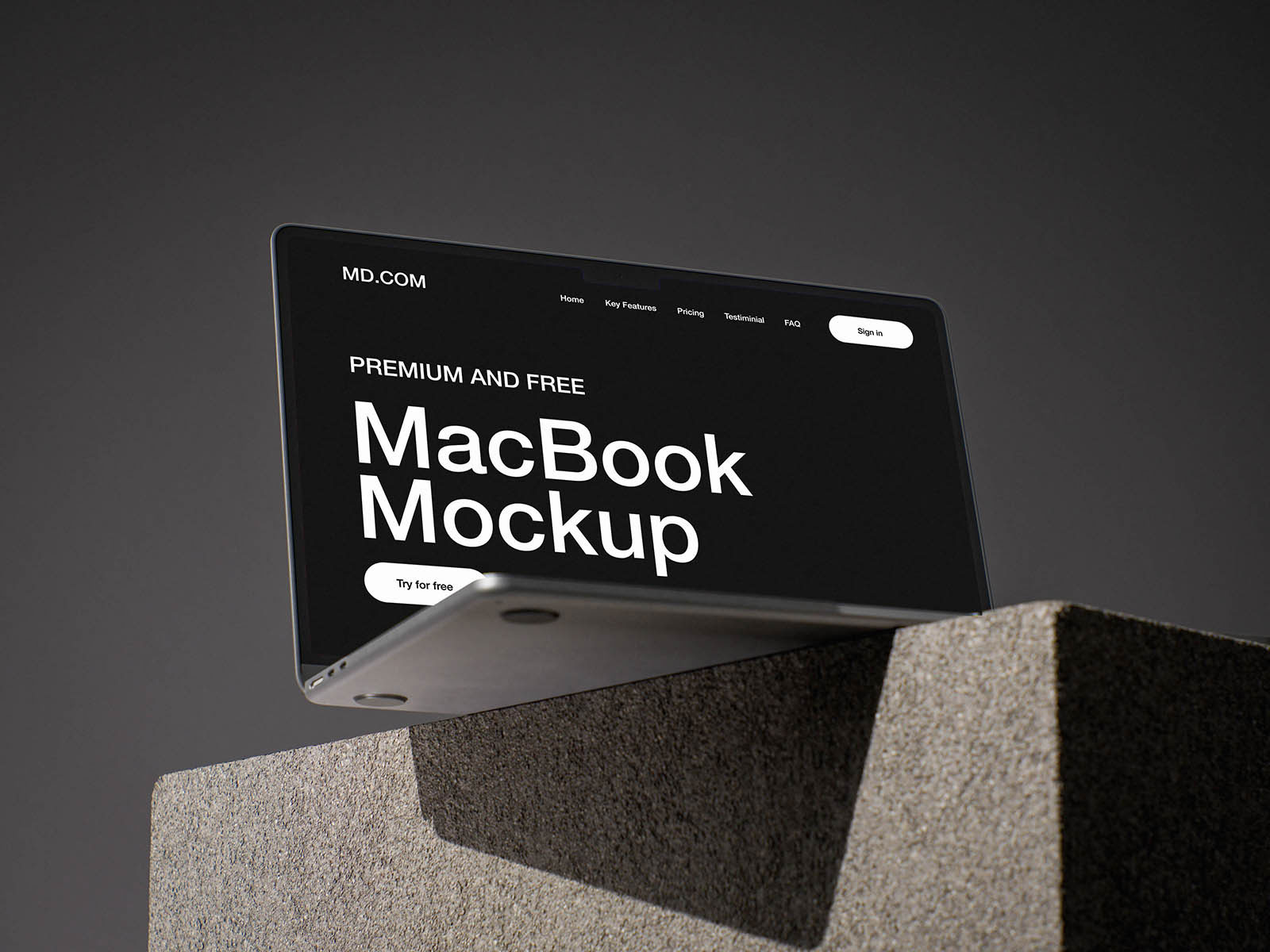 Free MacBook on Concrete Cube Mockup PSD Template