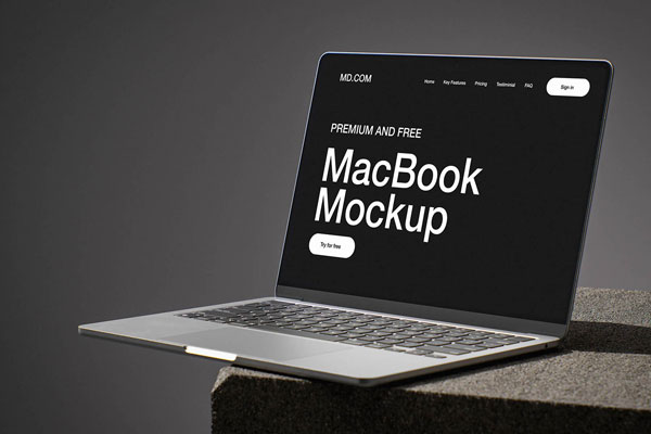 Free MacBook on Concrete Cube Mockup PSD Template