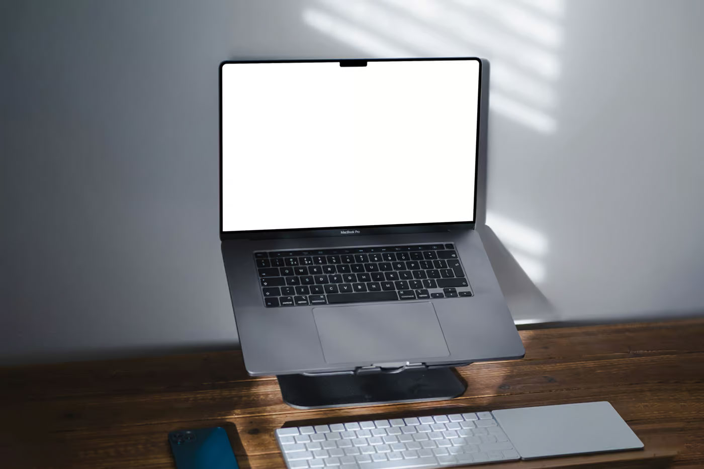 Free MacBook Pro on Stand Mockup PSD Template