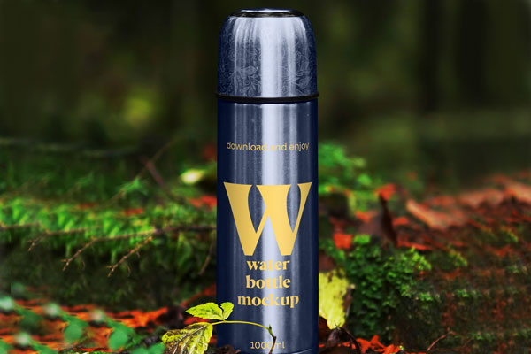 Free Thermos Bottle in Forest Mockup PSD Template