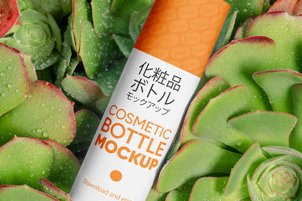 Free Cosmetic Bottle on Plant Mockup PSD Template
