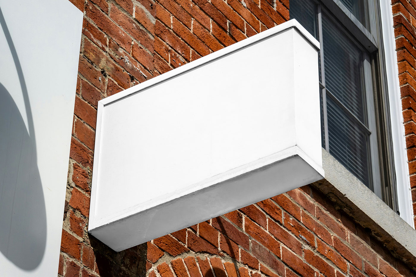 Free Signage on Brick Wall Mockup PSD Template