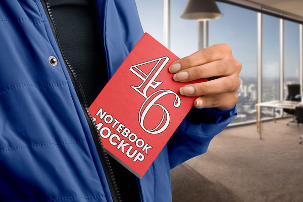 Free Notebook in Hand Mockup PSD Template