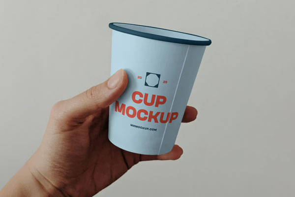 Free Paper Coffee Cup in Hand Mockup PSD Template