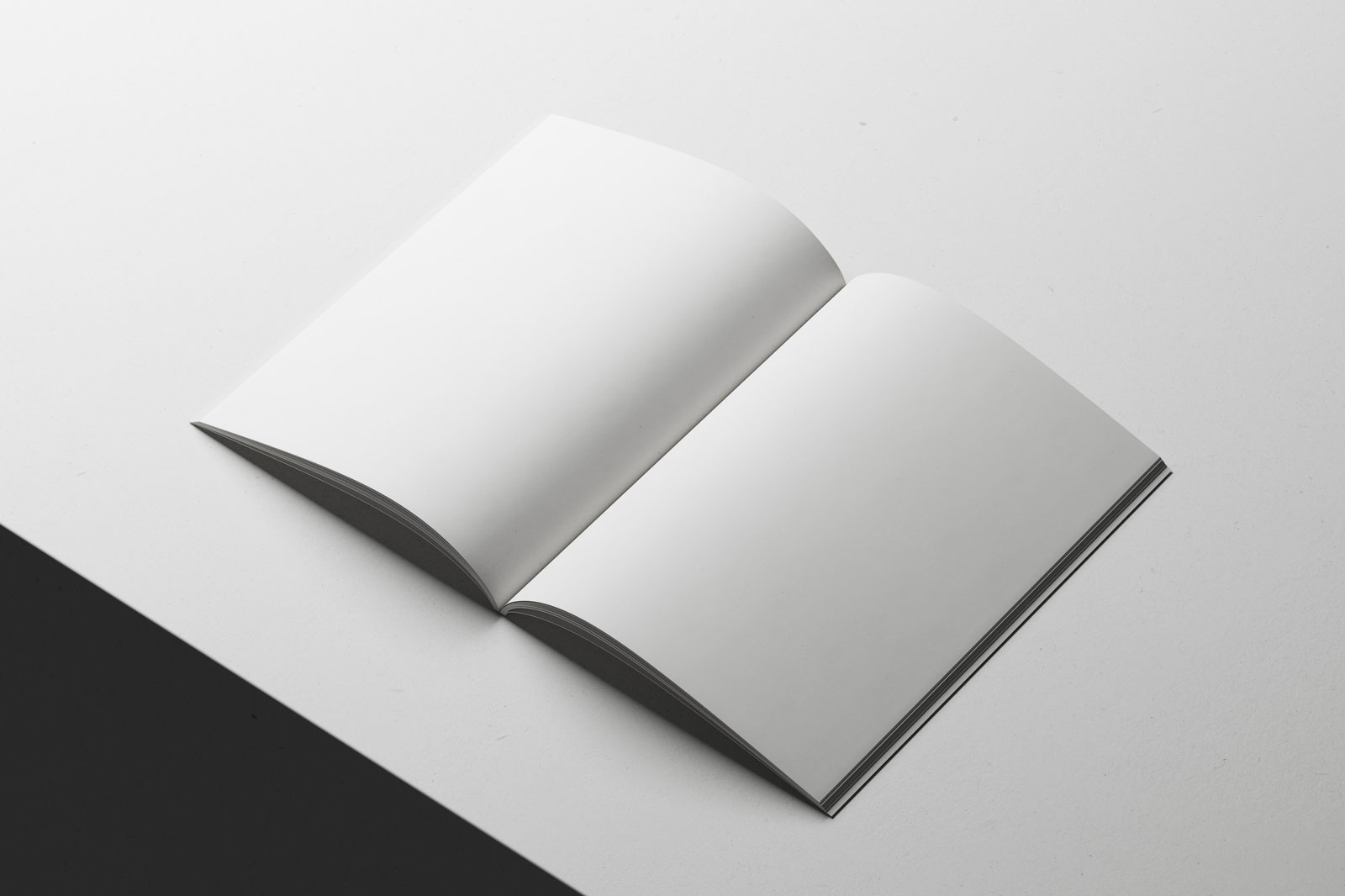 Free A4 Magazine Mockup Open on Minimal White Surface PSD Template