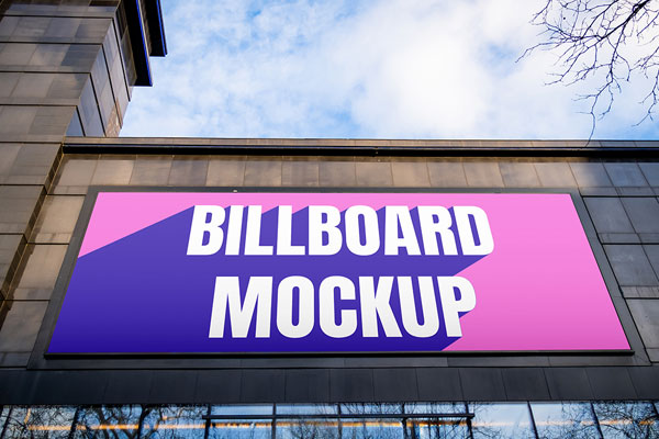 Free Billboard on Black Building Mockup PSD Template