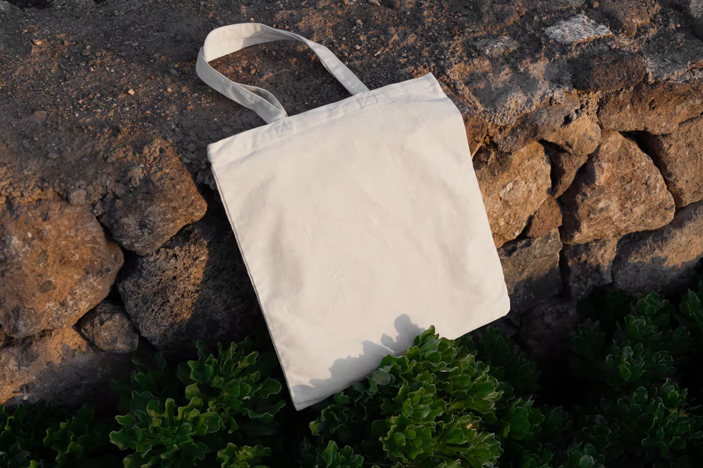 Free Canvas Bag Laying on Stones Mockup PSD Template
