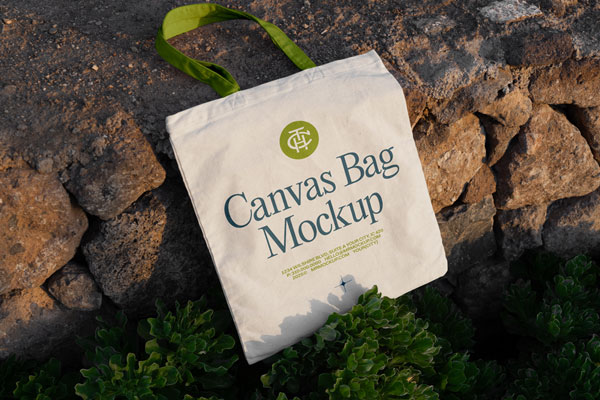 Free Canvas Bag Laying on Stones Mockup PSD Template